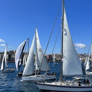 ARC 2023 Start - Hanse 415 Somnium and Hallberg-Rassy 53 Ariel crossing the line with the cruising fleet
