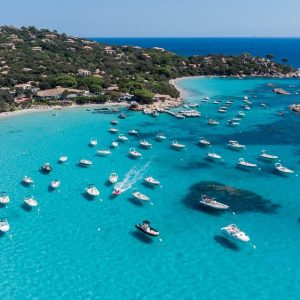 Aerial,View,Of,Some,Leisure,Boats,Anchored,Near,The,Beach