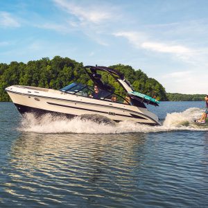 Kid wakesurfing behind an SDX 230 Surf