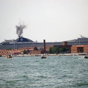 Activists of the committee 'No Grandi Navi' (No big ships), headed for the MSC Orchestra on board of small boats and waving flags, protest against the cruise ship being allowed in the Lagoon, during the navigation of the ocean-going liner in the Channel of the Giudecca, Venice, Italy, 05 June 2021.  Ansa/Andrea Merola